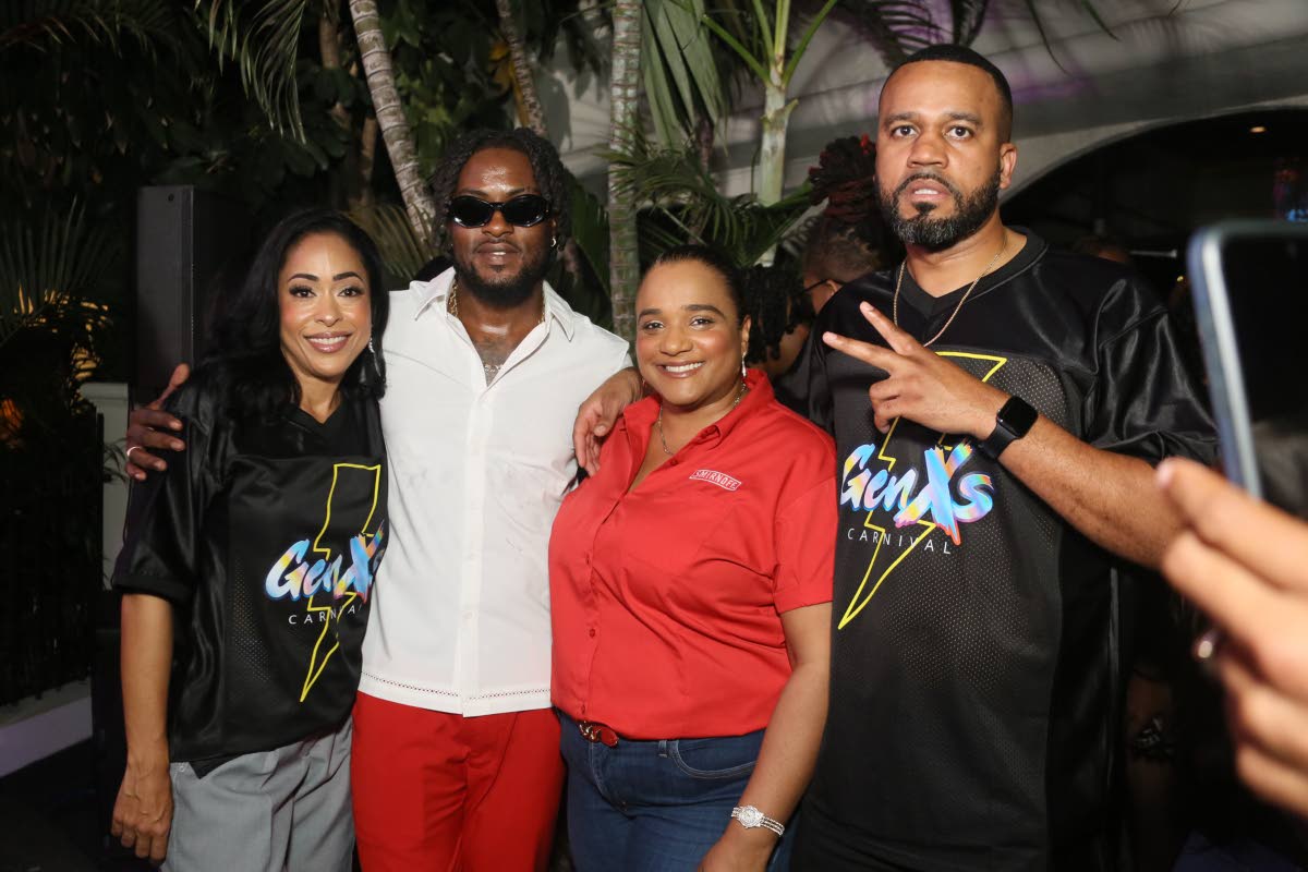 Ready to perform for revellers at the Gen XS Immortals J’ouvert, Grenadian soca artiste Muddy (second left), poses with Gen XS directors Mala Morrison (left) and Matthew Waddell (right) alongside Smirnoff Brand Manager, Nadine Hylton.
