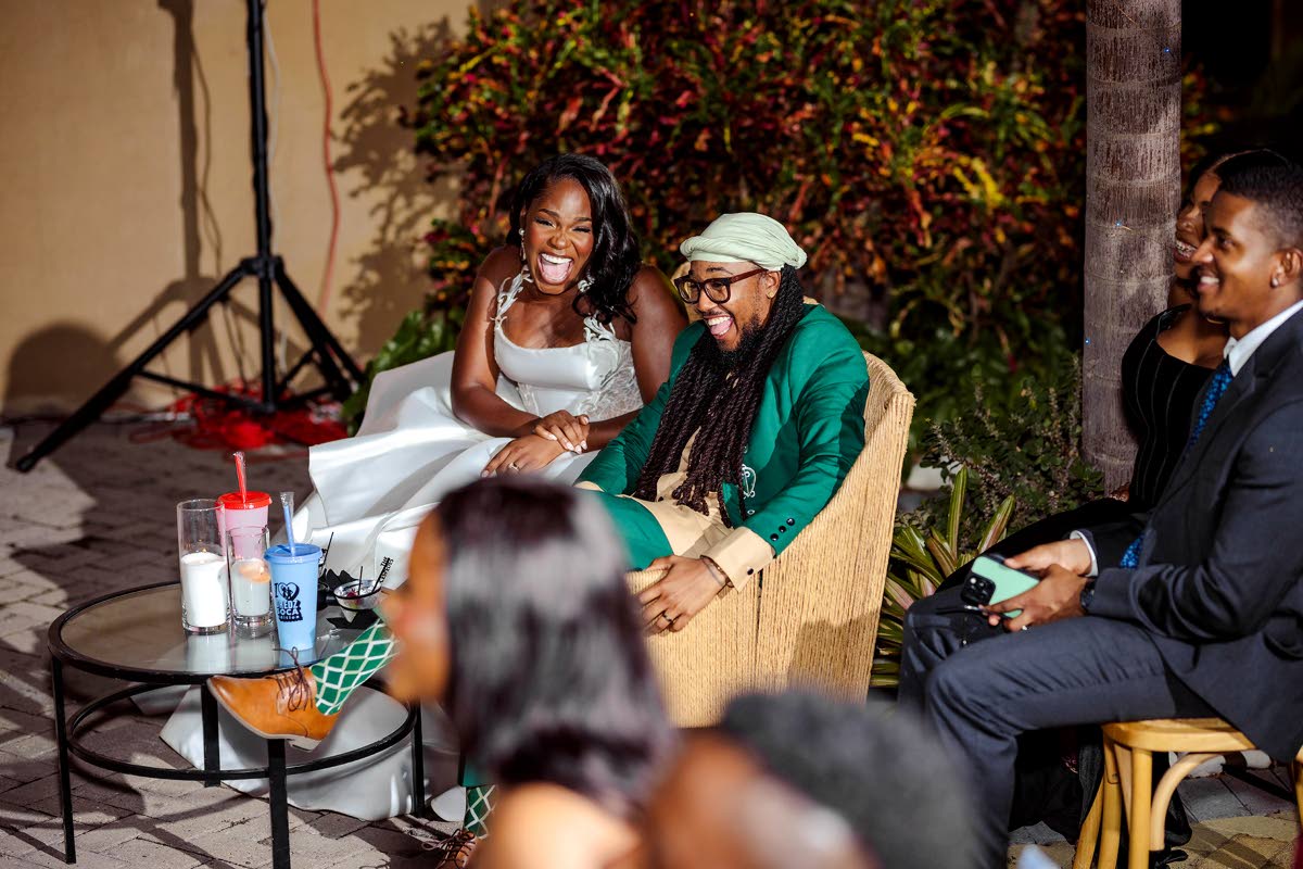 The newly-weds bask in nuptial bliss, their laughter and love lighting up the wedding reception.