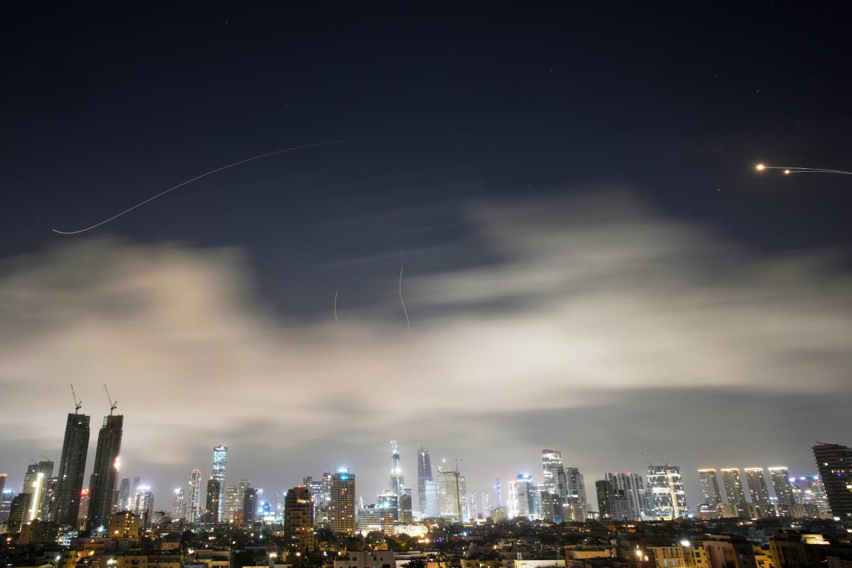 Israeli air defense system fires to intercept missiles during an Iranian attack over Tel Aviv, Israel, early Sunday, March 15.