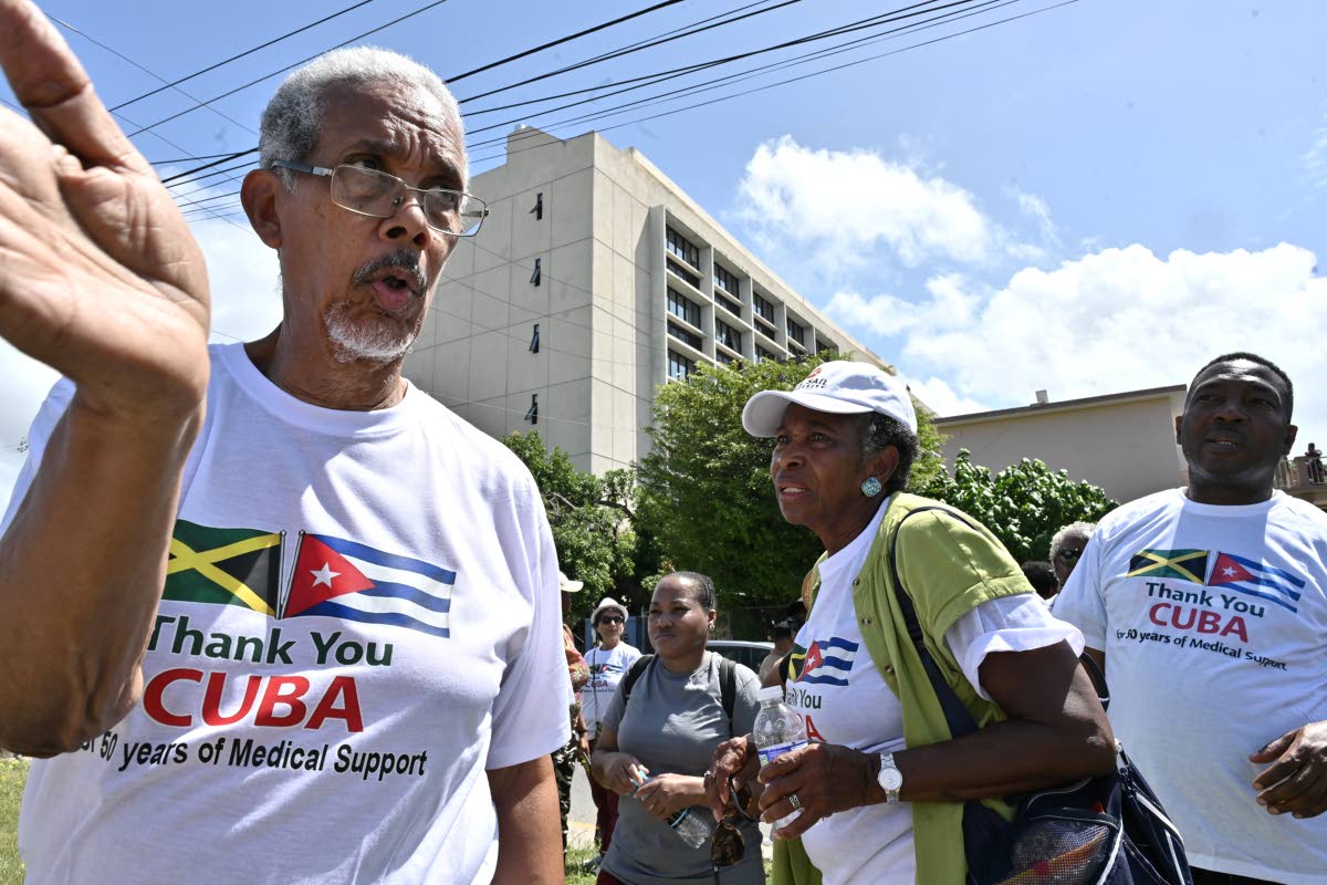Paul Burke (left) with supporters of Cuban medical workers during the Gratitude Walk.