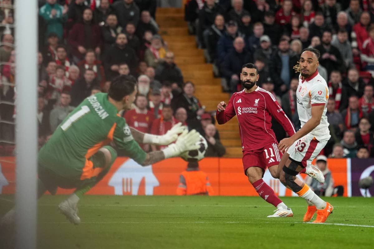 Liverpool's Mohamed Salah takes and misses a penalty during the second leg of the Champions League round of 16 football match between Liverpool and Galatasaray, in Liverpool, England on March 18, 2026. (AP Photo/Jon Super)

