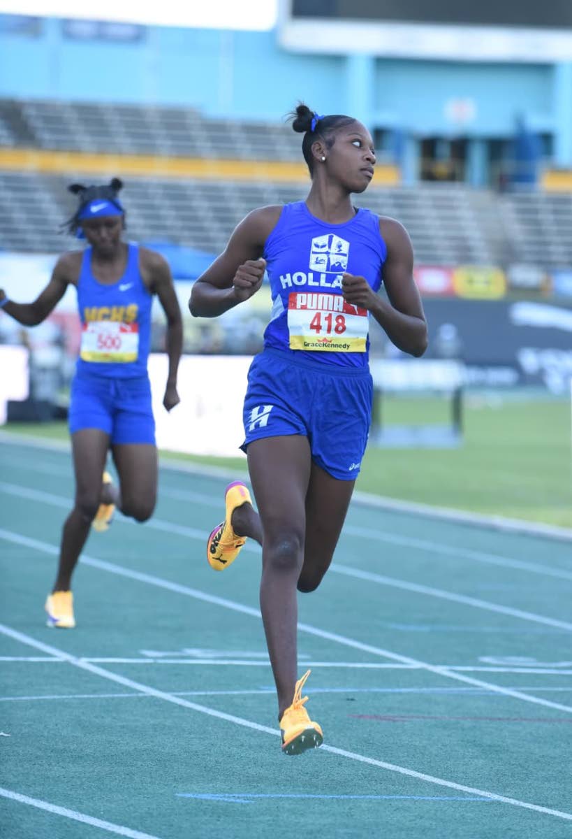 Holland High’s Shanoya Douglas runs 11.85 seconds to win her heat and advance to the Girls’ Class One 100m semifinals at the ISSA/GraceKennedy Boys and Girls’ Athletics Championships on March 24, 2026. (Ian Allen photo)