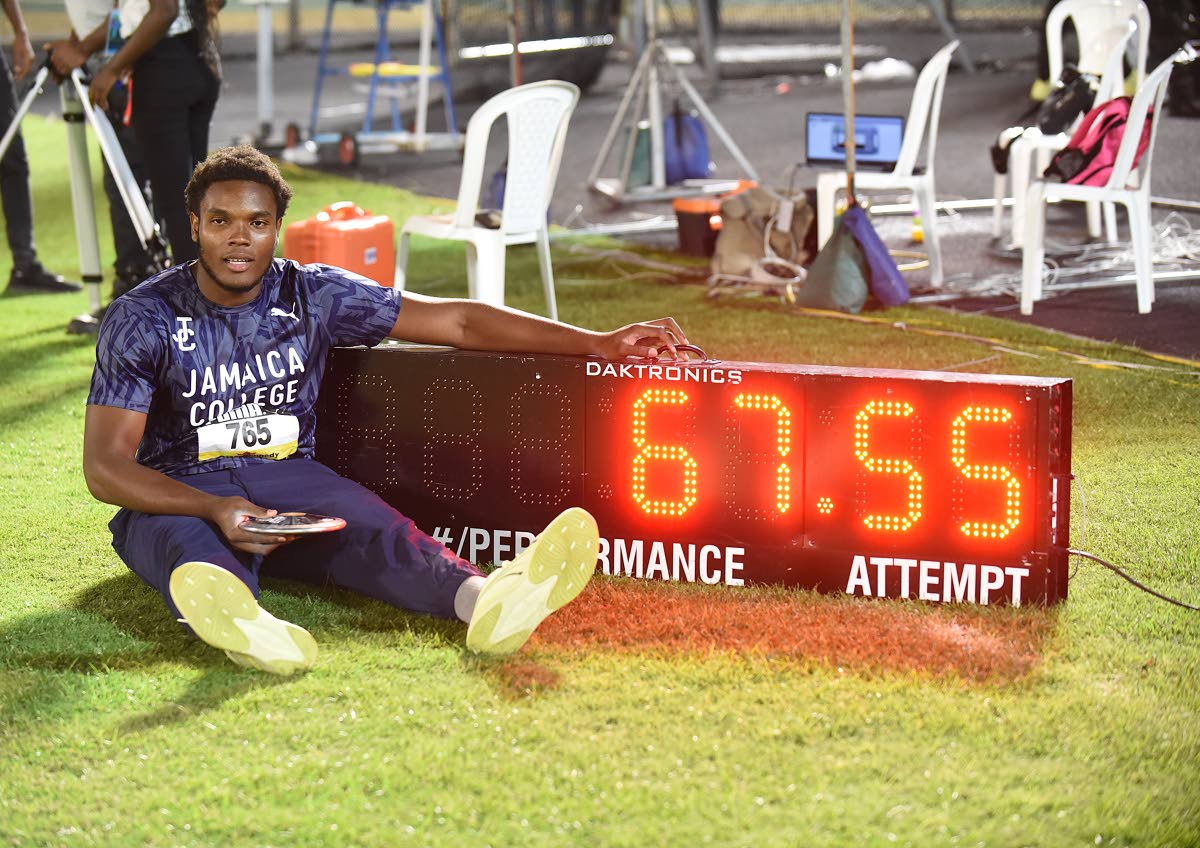 Joseph Salmon of Jamaica College celebrates after breaking the Boys’ Class One discus record twice and winning gold at the ISSA/GraceKennedy Boys and Girls’ Athletics Championships at the National Stadium last night.