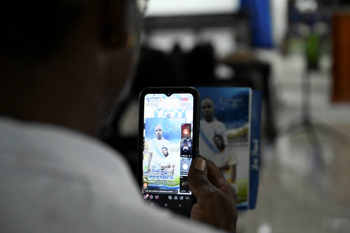 A mourner at yesterday’s funeral for Kiero Pinnock at the Regent Street Seventh-day Adventist Church in Kingston. 