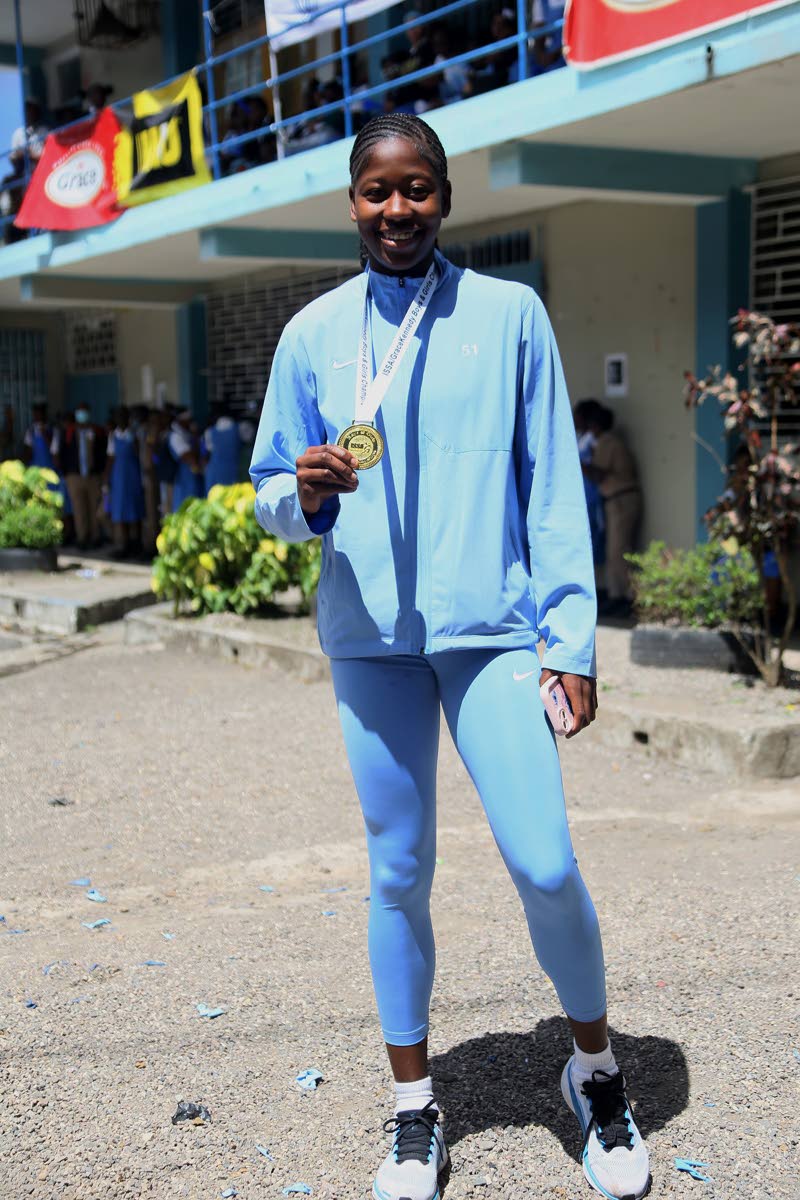Brittany Baron of Edwin Allen High School is celebrated for her outstanding performance during a ceremony at the school yesterday.
