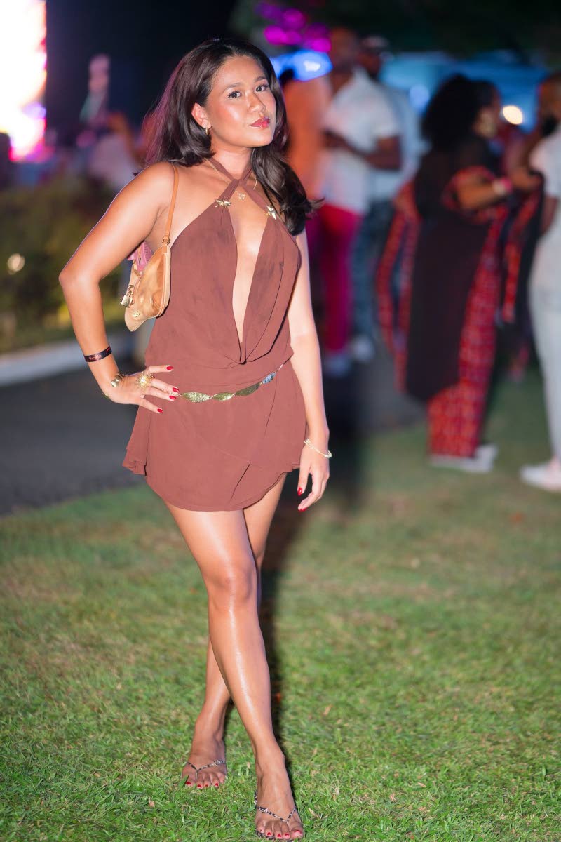 Alexi Lyn Shue, brand designer and creative director at Idyll Made Creative Studio, strikes a playful pose for the camera. 