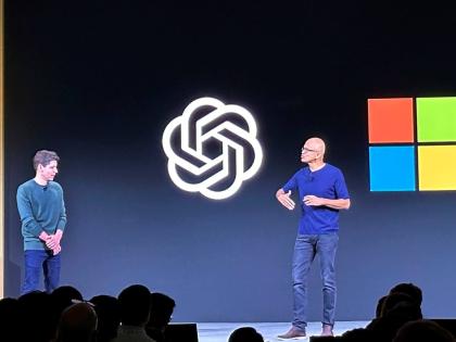 In this November 6, 2023 photo, OpenAI CEO Sam Altman, left, appears on stage with Microsoft CEO Satya Nadella at OpenAI’s first developer conference, in San Francisco.