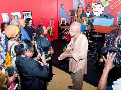 Jamaica Music Museum Director/Curator Herbie Miller addressing patrons, including Minister of Culture, Gender, Entertainment and Sport Olivia Grange, at the opening of the exhibition, ‘From African to Jamaican: Music and Creolized Black Culture’, insid