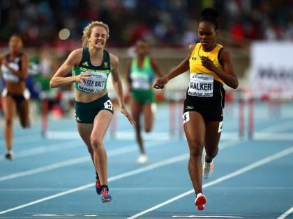 Zeney Van Der Walt of South Africa dips for the finish line ahead of Sanique Walker of Jamaica to win gold in the final of the girls 400m hurdles at IAAF U18 World Championships at the Kasarani Stadium in July 2017 in Nairobi, Kenya.