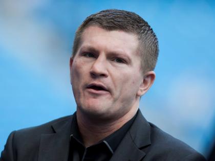 Boxer Ricky Hatton stands by the pitch before Manchester City's English Premier League soccer match against Manchester United at the Etihad Stadium, Manchester, England in September 22, 2013. 