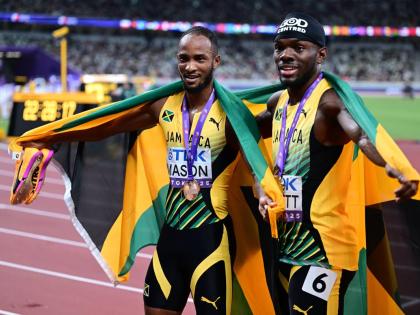 Silver medallist in the men’s 110m hurdles Orlando Bennett (right) and bronze medallist Tyler Mason celebrate on Day 4 of the World Athletics Championships in Tokyo, Japan.