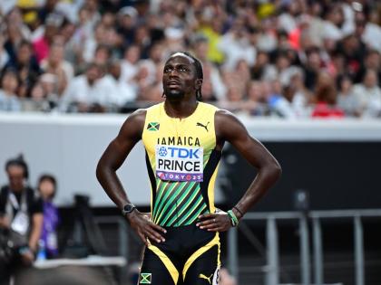 Demario Prince looks up at the monitor ahead of finding out he missed the World Athletics Championships 110-metre final by the slimmest of margins yesterday. 