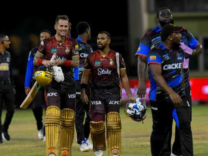 Trinbago Knight Riders’ Alex Hales (left) and Nicholas Pooran (second left) walk off the filed with players of the Antigua and Barbuda Falcons at the end of the Republic Bank Caribbean Premier League Eliminator at Guyana National Stadium in Providence, G