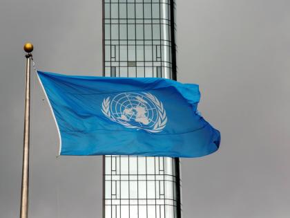 The UN flag flies on a stormy day at the United Nations during the United Nations General Assembly in September 2022.