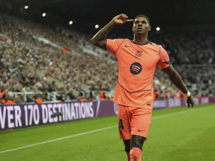 Barcelona’s Marcus Rashford celebrates after scoring his team’s second goal during the Champions League, opening phase match between Newcastle and Barcelona in Newcastle, England, yesterday.