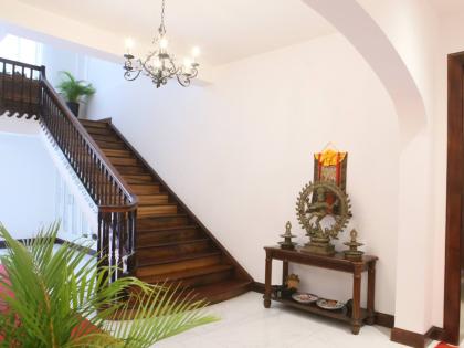 The main mahogany staircase rises in elegance to the next level.