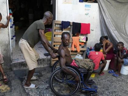 People displaced by gang violence spend time at a makeshift shelter in Port-au-Prince, Haiti on Wednesday.
