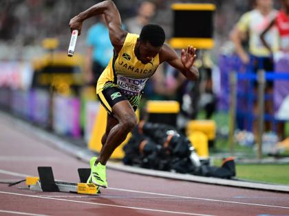 Gladstone Taylor/
Multimedia Photo Editor 
Jamaica’s Bovel McPherson pushes from the blocks on the first leg of the men’s 4x400-metre relay heats at the World Athletics Championships in Tokyo, Japan yesterday. Jamaica advanced after finishing fourth in