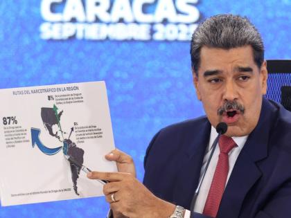 Venezuelan President Nicolas Maduro points at a map of the Americas during a press conference in Caracas, Venezuela, Monday, September 15.