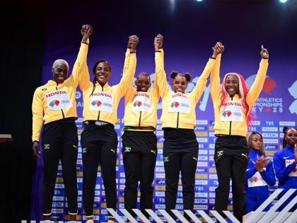 Jamaica’s 4x100m relay members (from left) Jodean Williams (who ran in the heats), Jonielle Smith, Tina Clayton, Tia Clayton and Shelly-Ann Fraser Pryce on the podium to receive their silver medals.