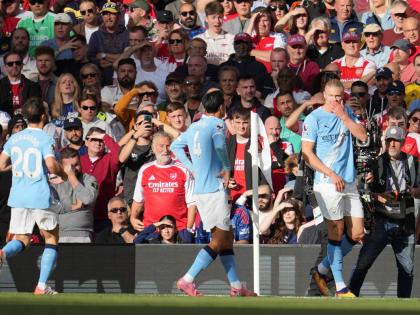 Manchester City’s Erling Haaland (right) celebrates after a goal during the English Premier League  match against Arsenal in London yesterday.
