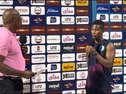 West Indies stand-in captain Ackeal Hosein (right) speaks to commentator and former West Indies fast bowler, Ian Bishop after his side completed a 10-wicket win over Nepal in the third T20I at the Sharjah Cricket Stadium on Tuesday.