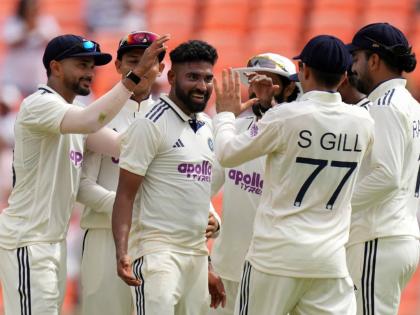 India’s Mohammed Siraj (centre)  celebrates with teammates after the dismissal of West Indies’ Brandon King on the first day of the first Test  at Narendra Modi Stadium in Ahmedabad, India yesterday.
