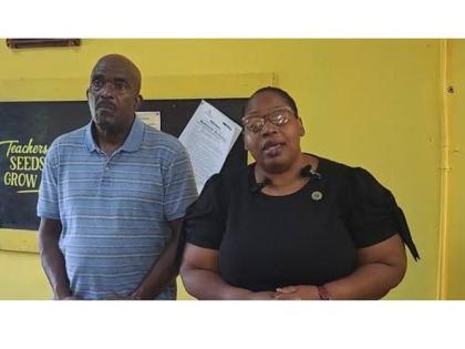 Principal of Rosemount Primary and Infant School in St Catherine  Malaika Sinclair Bailey (right) and School Board Chairman Bishop Courtney Golding.