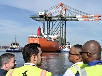 Kingston Freeport Terminal staff looks on as the Port Authority of Jamaica and Kingston Freeport Terminal Limited officially welcome the arrival of two new Super Post-Panamax cranes – a US$20-million investment aimed at expanding Jamaica’s capacity to 