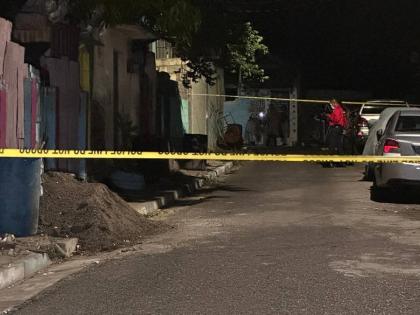 The scene of a drive-by shooting on Text Lane in central Kingston on Tuesday night. In the incident, four minors, including two children under age 10 and two teenagers, were among six people shot.