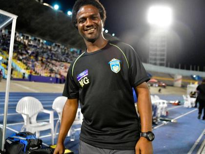 St George’s College assistant coach, Marcel Gayle, is pleased with team’s performance against St Jago at Winchester Park yesterday. St George’s College won 3-1.