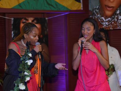 Reggae singer Jaz Elise (left) joins Cowan onstage for an impromptu duet.
