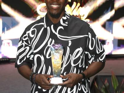 Johnmark Wiggan poses with his award at the Sterling Gospel Music Awards held last Saturday at Emmanuel Apostolic Church, Braeton Parkway, Portmore, St Catherine.