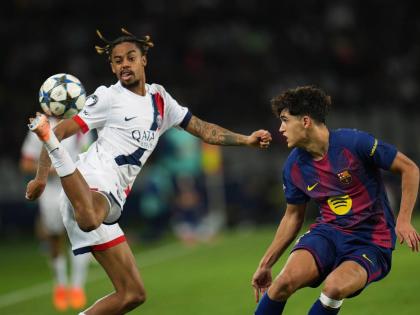 PSG’s Bradley Barcola (left) controls the ball ahead of Barcelona’s Pau Cubarsi during the Champions League opening phase match at the Lluis Companys Olympic Stadium in Barcelona, Spain, on Wednesday, October 1. 