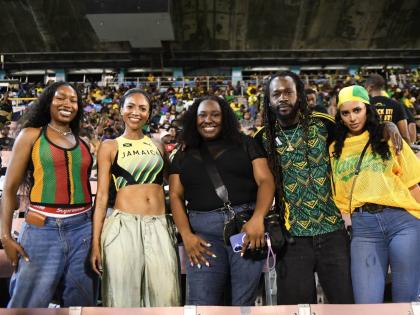 From left: Ayana Rivière, Naomi Cowan, Lauren ‘Lo’ Watkis, Jesse Royal and Gabriel Davis pose in the grandstand as the Reggae Boyz face Bermuda at the National Stadium in St Andrew on Tuesday.