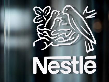 In this Thursday, February 14, 2019, file photo, Nestle’s logo is displayed on a window, during the 2018 full-year results press conference of the food and drinks giant Nestle, in Vevey. 