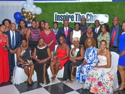  Members of the Kiwanis Club of West St Andrew, along with executive members of Kiwanis International, following the installation ceremony for the club’s new administration, held at the Terra Nova All-Suite Hotel. The new administration is headed by Maur