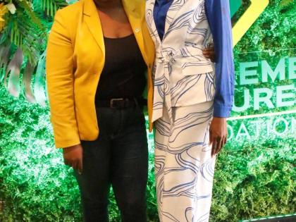 Tishauna Mullings (right) is joined by Chloleen Daley-Muschett, assistant vice-president of public relations and corporate affairs, for a quick photo during the Supreme Ventures Foundation Supreme Community Hero Programme finale.