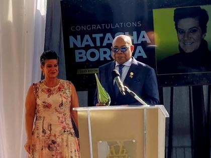 Minister of Tourism Edmund Bartlett and Natasha Borota, grand prize winner of the Edith Baxter Memorial Award, at Palais Royale in Toronto.