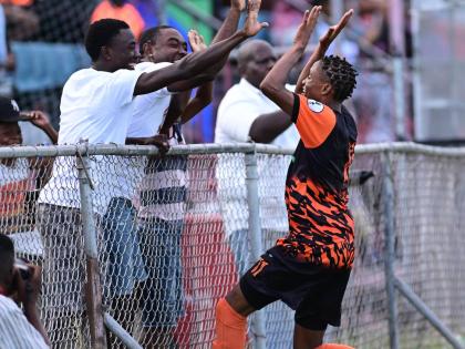 Tivoli Gardens FC’s Nickalia Fuller (right) celebrates with fans after scoring against Dunbeholden in a Lynk Cup match at the Anthony Spaulding Sports Complex on Wednesday, April 12, 2023.