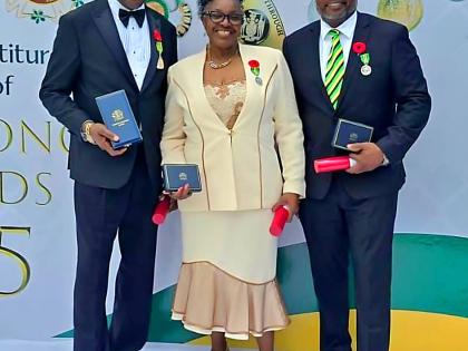 From left: Sylvanus Thompson, Vivienne Nelson-Campbell and Chris Campbell pose with their awards on Monday.