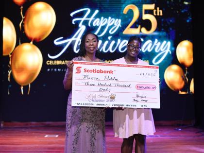 Marissa Peddie (right), recipient of the Bishop Philmon Samuels Scholarship, accepts a cheque representing the scholarship towards her degree in primary education at Sam Sharpe Teachers’ College from Olga Samuels, senior founding pastor of the Fresh Brea