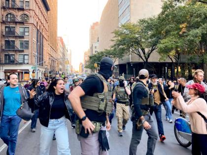 Protesters confront Federal agents as they walk down Lafayette Street after an immigration sweep on Canal Street through Chinatown, Tuesday, October 21, 2025, in New York. (AP Photo/Jake Offenhartz)