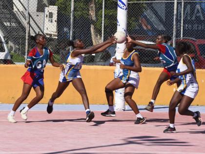 Camperdown High players (blue and red) and their Gaynstead opposition get into a scramble for the ball during an ISSA urban schoolgirl senior netball game at the Leila Robinson Courts last year.