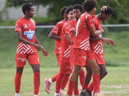 Members of the Campion College  team celebrate their second goal against Norman Manley High during their Manning Cup football match played at Campion College last Friday. Campion won 4-0.