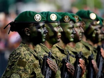 Croatian troops participate in a military parade marking 30 years since a key war victory, in Zagreb, Croatia, Thursday, July 31, 2025.
