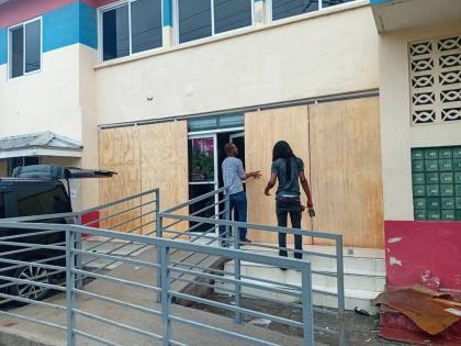 Workmen securing the Ocho Rios Post Office on Friday, October 24, ahead of the passage of Tropical Storm Melissa.