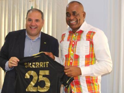 Prime Minister of Dominica, Roosevelt Skerrit (right), presents a jersey to FIFA vice-president and Concacaf president, Victor Montagliani, during his visit to the island yesterday.