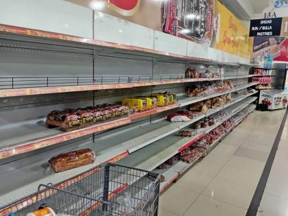 Partially empty shelves in a supermarket in Ocho Rios, St Ann on Friday, October 24, ahead of the passage of Tropical Storm Melissa.