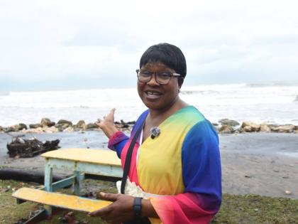 Sixty-one-year-old Barbara Mason, an Antiguan visiting Jamaica for a family event, watches the rising tides at Alligator Pond in Manchester on October 26, 2025 as outer bands from Hurricane Melissa lash the island’s southern coast with heavy rain and str